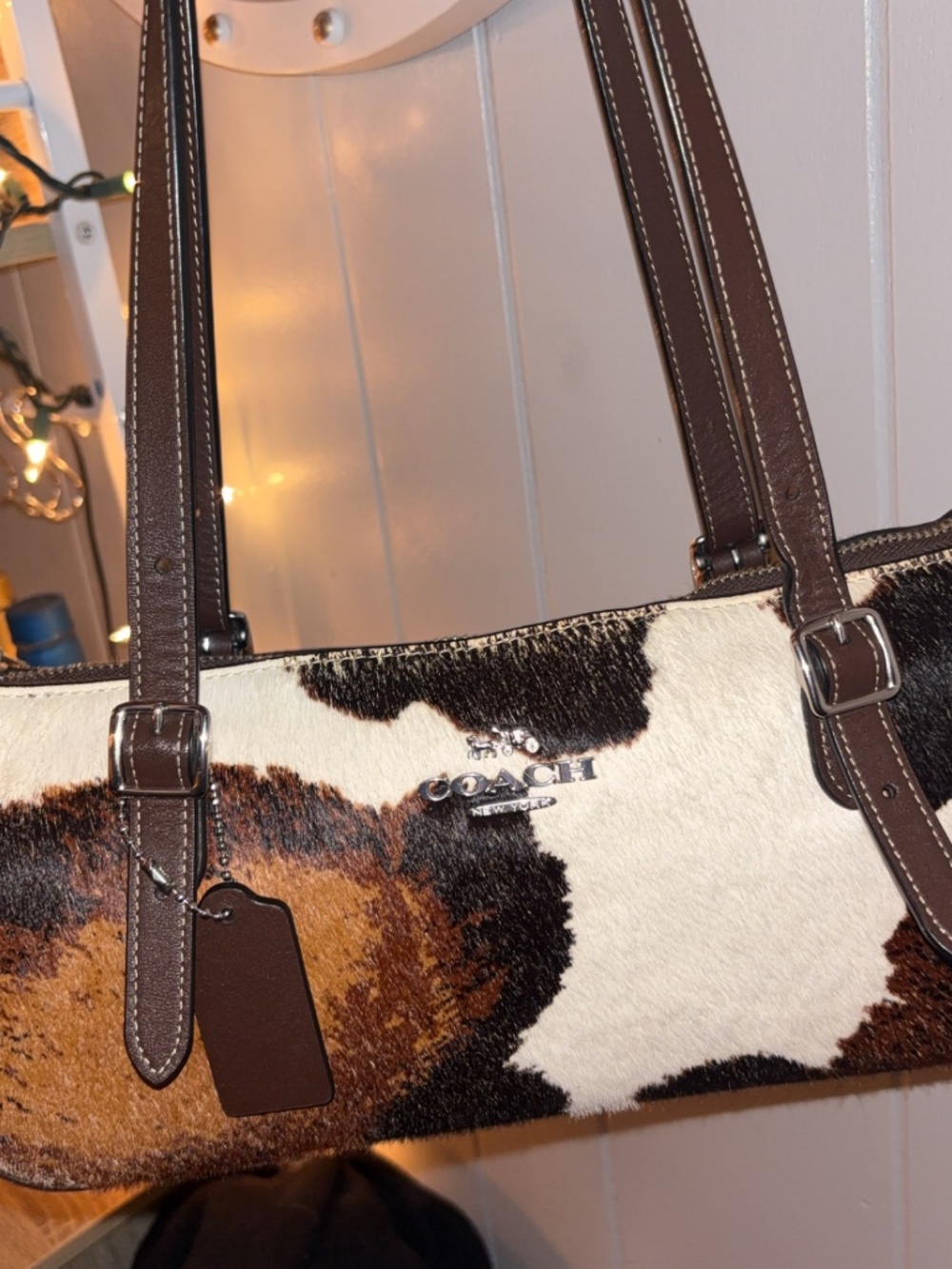Coach cow print shoulder bag